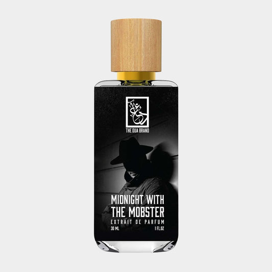 A sleek 30ml bottle of Dua Midnight with the Mobster perfume, featuring an artistic design with a silhouette of a mobster. The bottle is topped with a natural wooden cap, giving it an elegant touch.