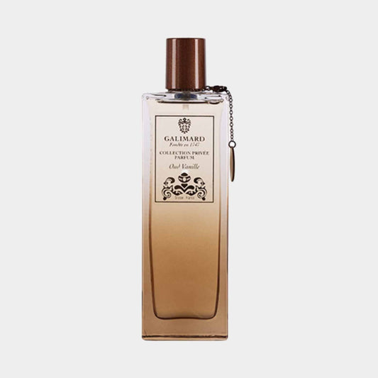 Sample bottle of Galimard Oud Vanille from the Collection Privée, featuring an elegant design with a gradient amber hue and a stylish cap.