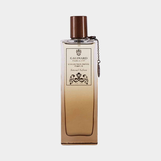 A bottle of Galimard Sensuel Safran from the Collection Privée, featuring an elegant design with a bronze cap and a decorative label, showcasing the luxurious scent within.