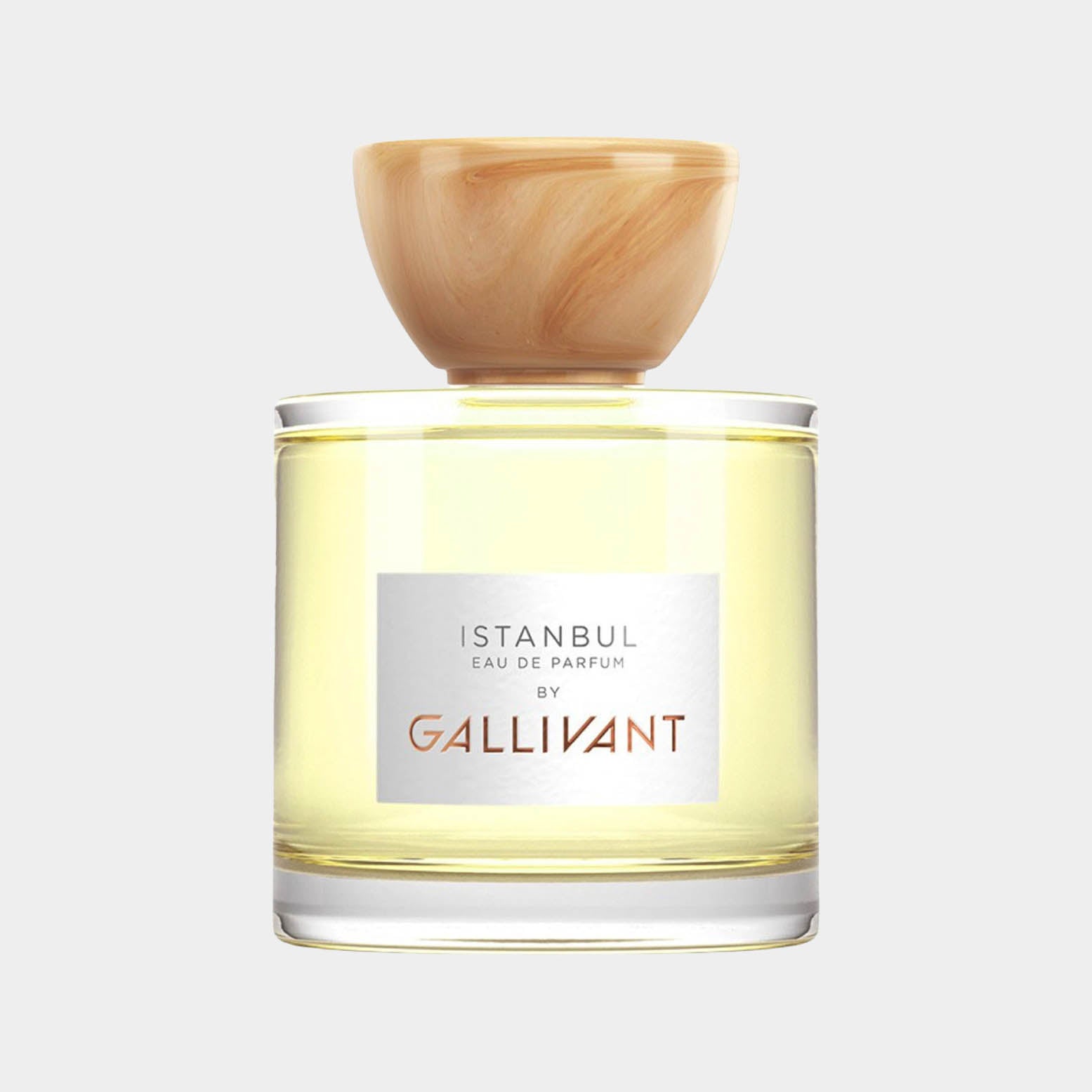 Gallivant Istanbul Sample is a clear glass parfum bottle with a wooden cap, showcasing a light yellow fragrance inside, elegantly labeled with the brand name.