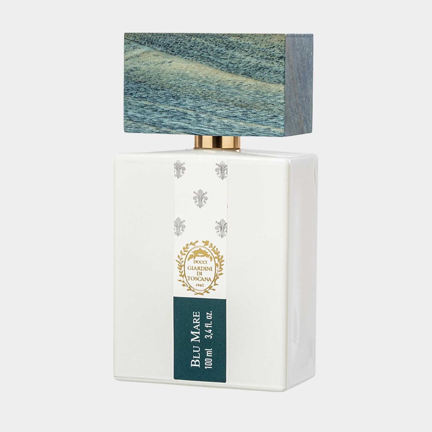 A white rectangular perfume bottle labeled Giardini di Toscana Blu Mare Sample with a textured blue cap resembling ocean waves, featuring a gold accent and floral emblem.