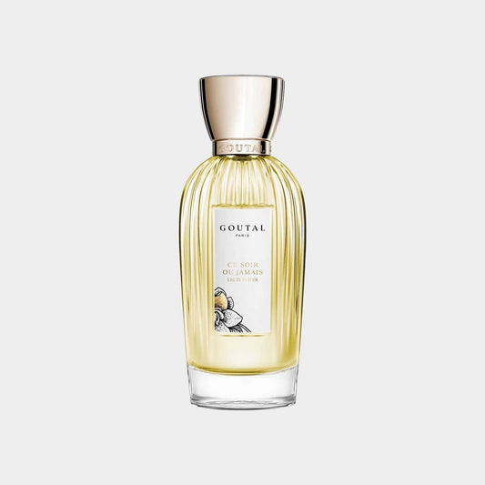 A bottle of Goutal Ce Soir Ou Jamais perfume, featuring an elegant ribbed design and a golden cap, set against a light gray background.