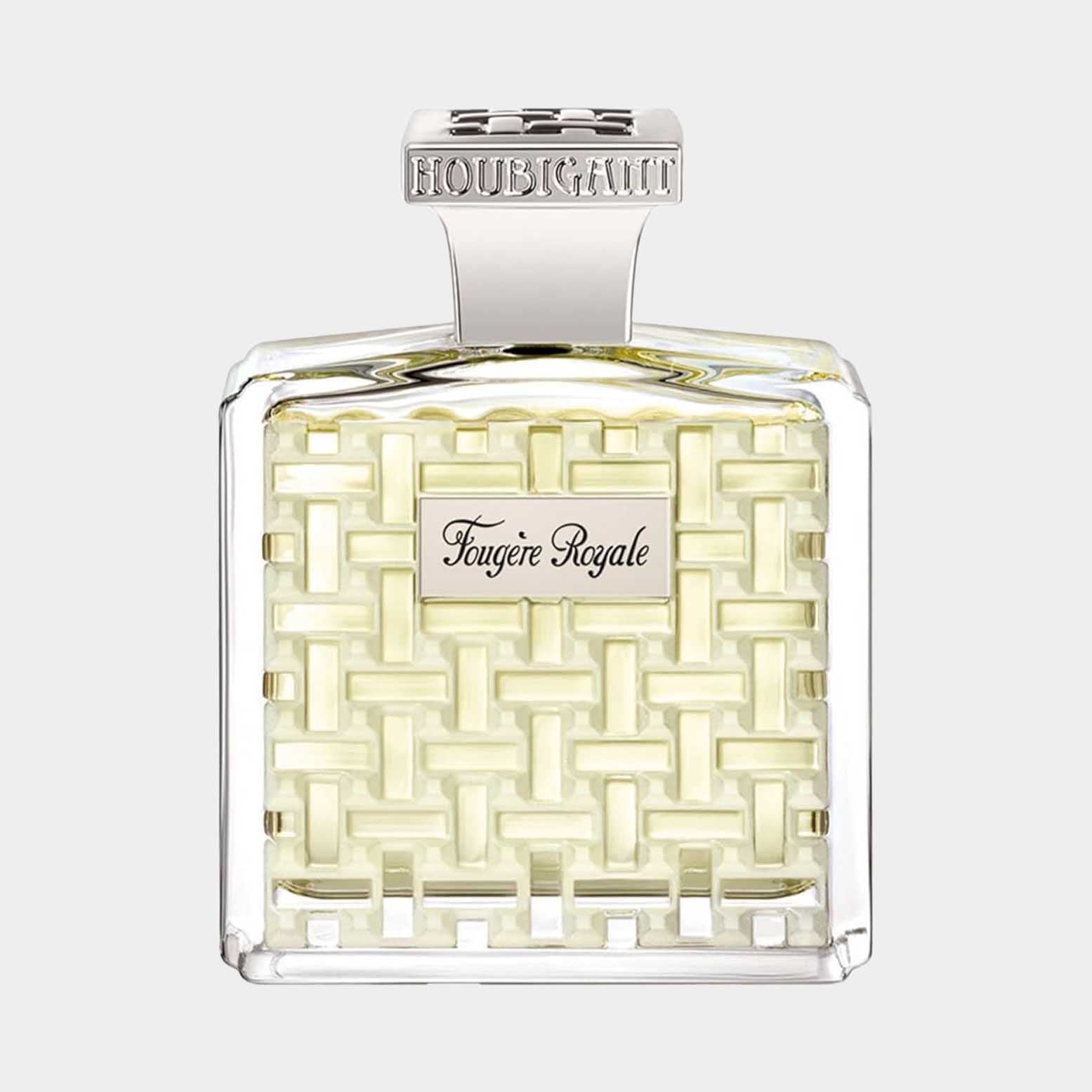 A clear glass sample bottle of Houbigant Fougere Royale, featuring an elegant woven design and a silver cap. The fragrance has a light yellow hue, showcasing its luxurious appeal.