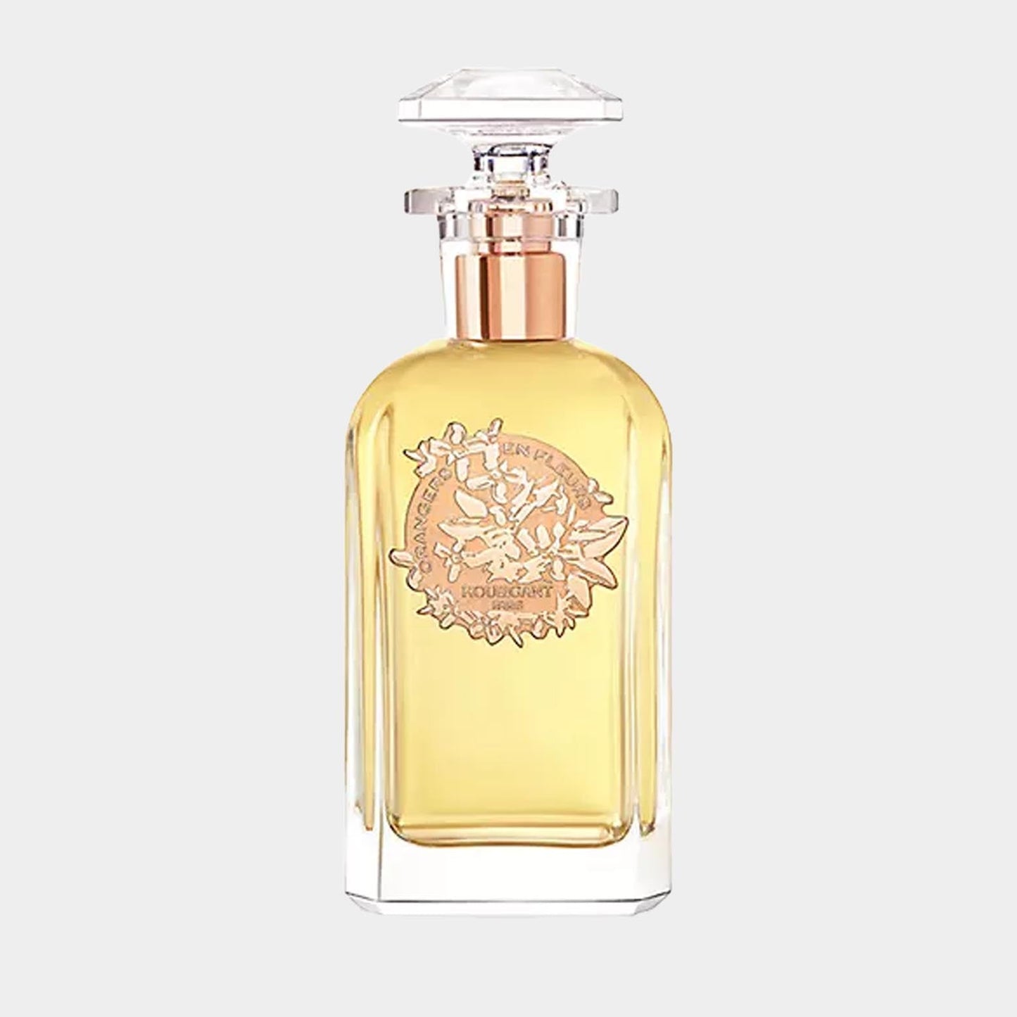 A stylish glass perfume bottle of Houbigant Orangers en Fleurs Sample, featuring a golden liquid and an ornate label with floral designs. The bottle has a decorative stopper, highlighting its elegant design.