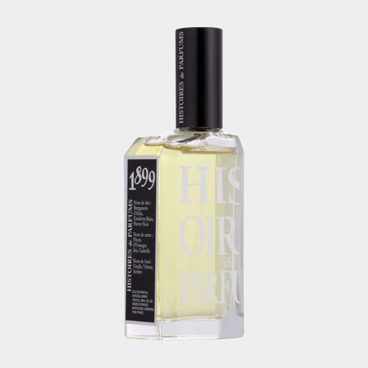 A sample bottle of Histoires de Parfums 1899 Hemingway, featuring a clear glass design with a black cap and label, showcasing a light yellow fragrance.