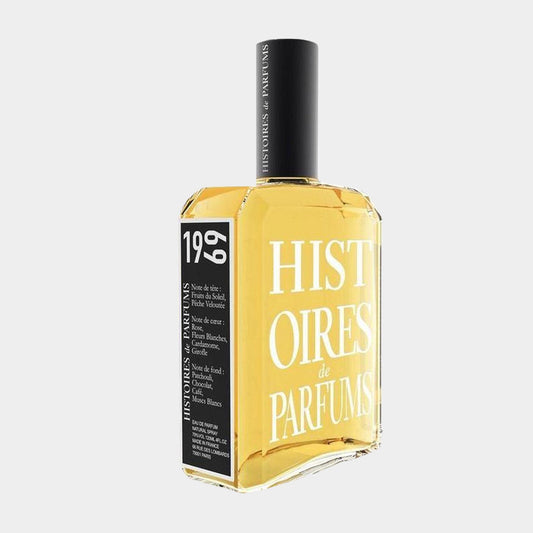 A bottle of Histoires de Parfums 1969 Sample, featuring a sleek glass design with a bold black and yellow label, showcasing its distinct fragrance in a clear liquid.