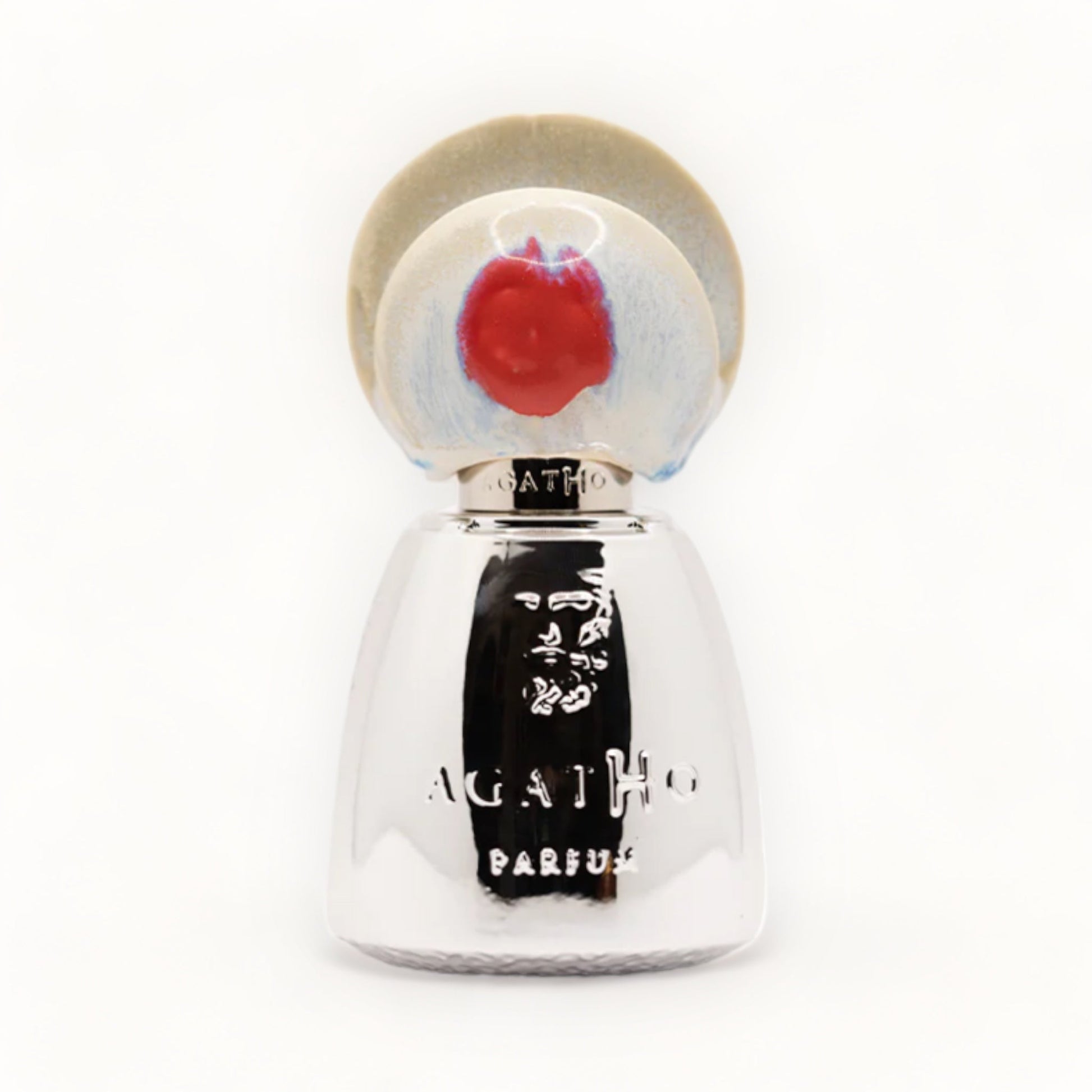 A sleek silver bottle of Agatho Parfum 195 A.C. Sample, featuring a decorative cap with a colorful design. The bottle is elegantly shaped, showcasing the brand name prominently on the front.