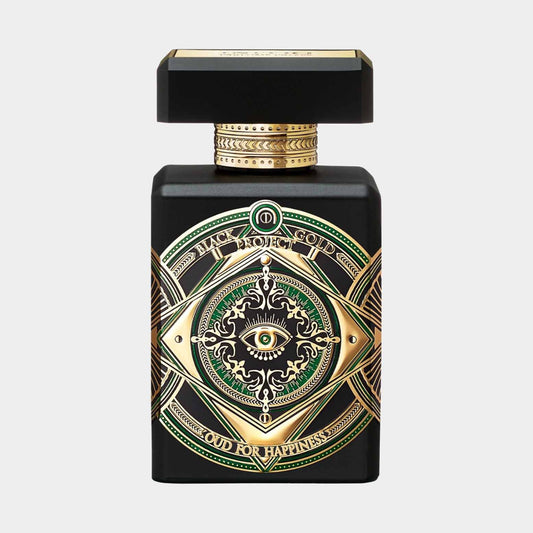Black bottle of Initio Oud for Happiness Sample featuring ornate gold and green detailing, with a stylized eye design on the front. The luxurious packaging reflects the exotic and uplifting essence of the fragrance.