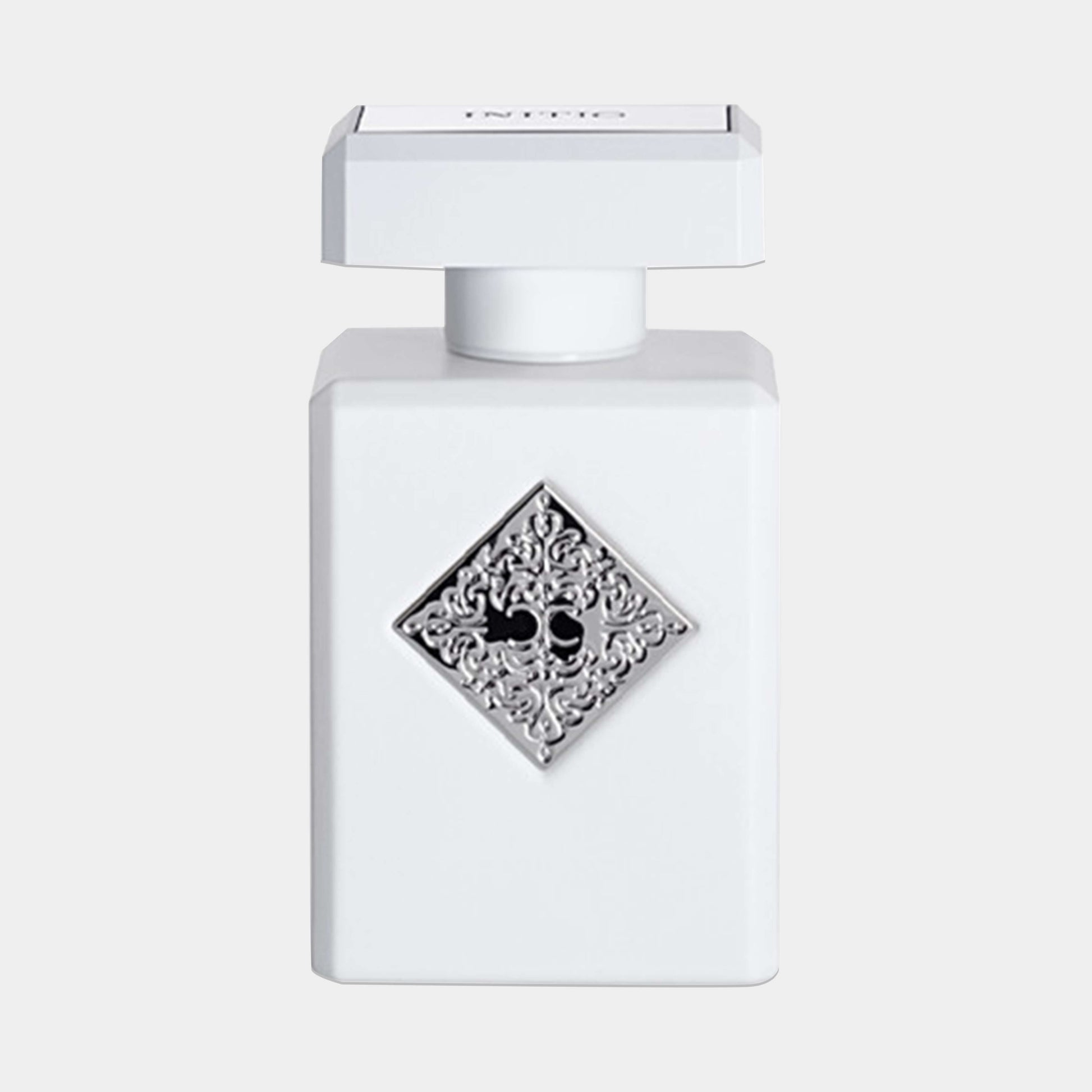 Initio Rehab Sample fragrance bottle, featuring a white design with an ornate silver diamond emblem and skull motif, showcasing a luxurious and elegant presentation.