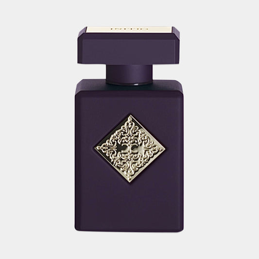 A dark purple fragrance bottle with an ornate gold diamond emblem, featuring a square cap, labeled 'Initio Blessed Baraka Sample'.