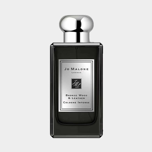 A sample bottle of Jo Malone London Bronze Wood & Leather, featuring a sleek design with a silver label and cap, showcasing its elegant and intense fragrance.