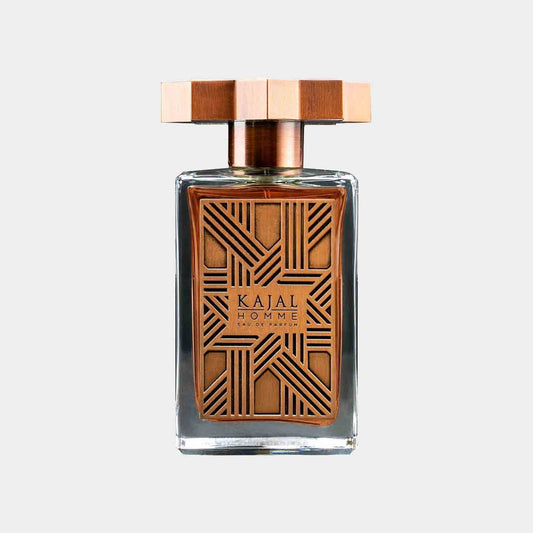 A full bottle of Kajal Homme fragrance, featuring an ornate brown glass design with intricate geometric patterns and a distinctive wooden cap. The elegant packaging reflects a sophisticated and luxurious scent for men.