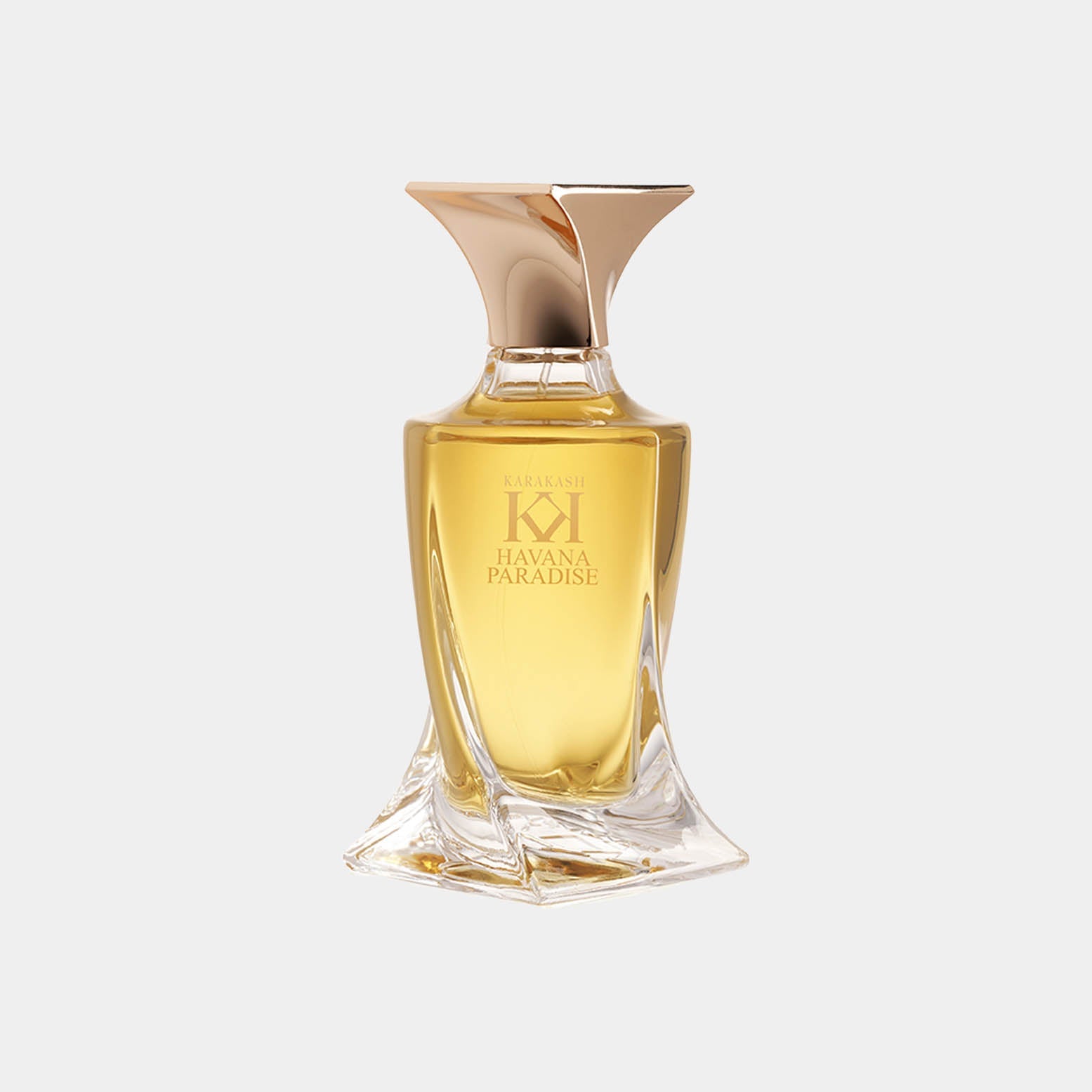 A luxurious bottle of Karakash Havana Paradise Sample perfume, featuring a golden liquid and an elegant, sculptural design with a distinctive flared cap.