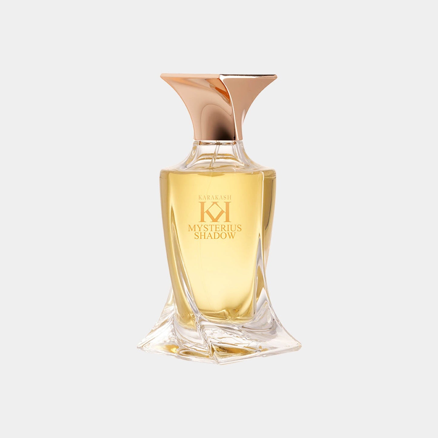 A stylish glass perfume bottle of Karakash Mysterious Shadow Sample, featuring a unique curved design and a gold cap, containing a warm golden liquid.