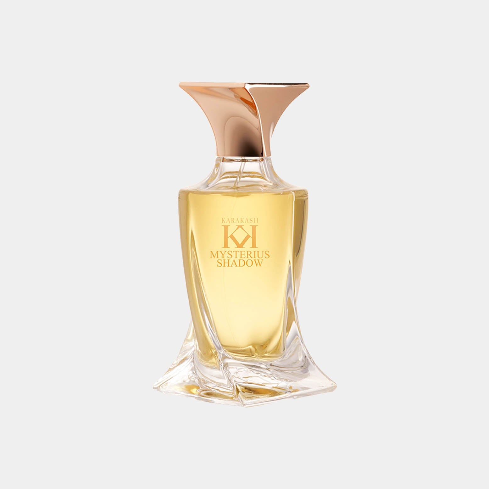 A stylish glass perfume bottle of Karakash Mysterious Shadow Sample, featuring a unique curved design and a gold cap, containing a warm golden liquid.