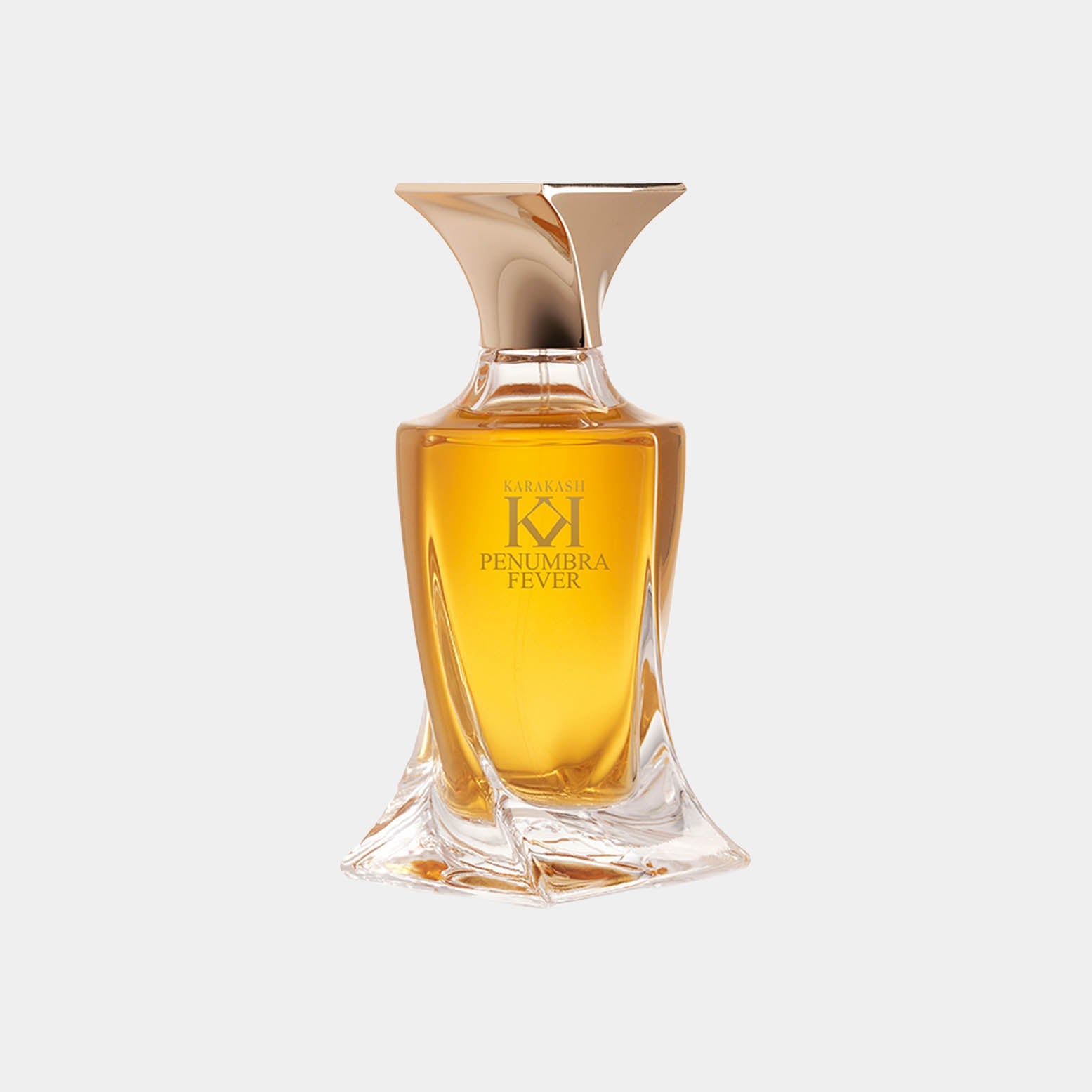 A stylish glass bottle of Karkash Penumbra Fever Sample perfume, featuring a unique shapely design and a golden liquid inside, exuding elegance and luxury.