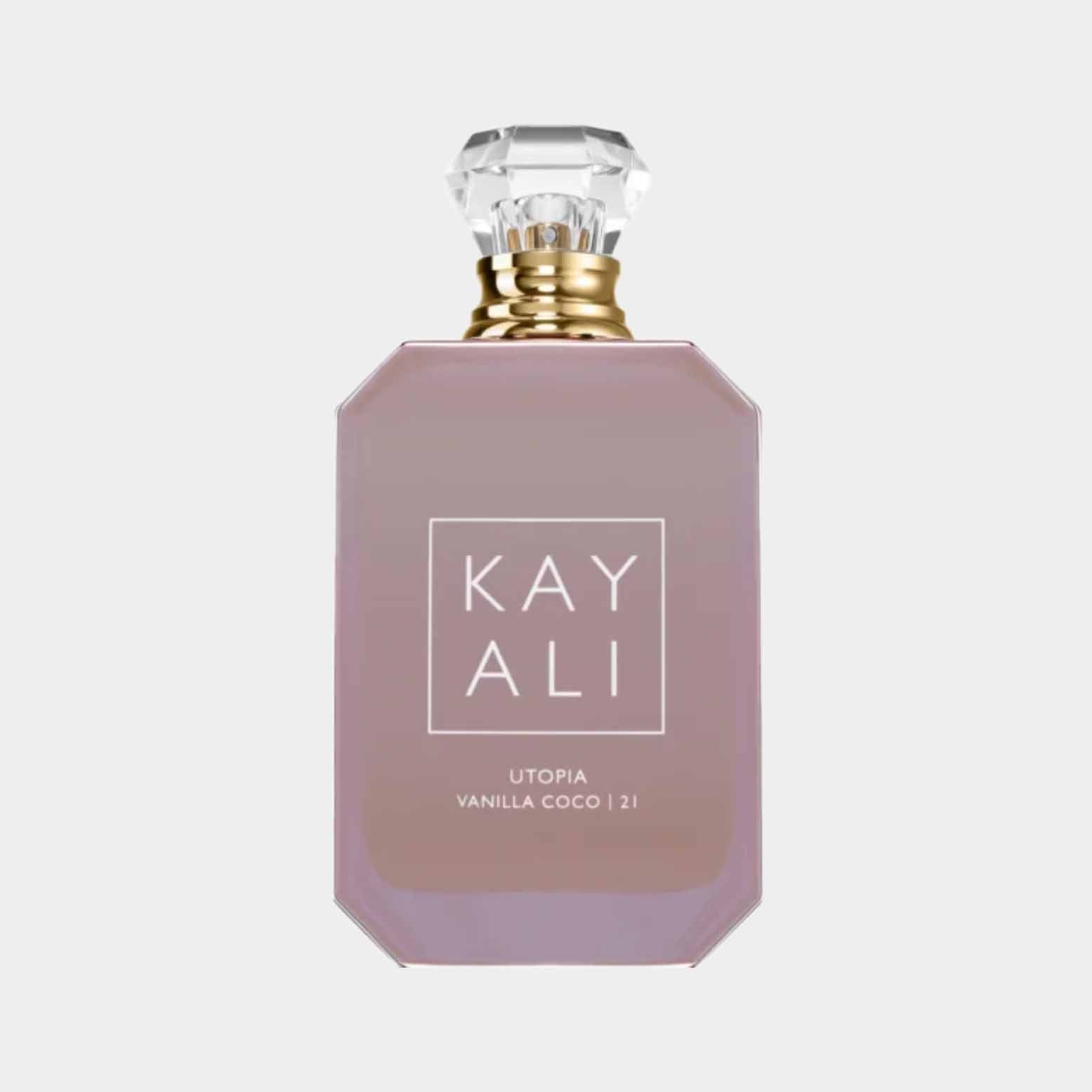 A stylish bottle of Kayali Utopia Vanilla Coco 21 perfume, featuring a sleek, pink design with a decorative cap and the brand name prominently displayed on the front.