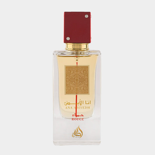A full bottle of Lattafa Perfumes Ana Abiyedh Rouge, featuring a clear glass design with a gold label and a striking red cap. The elegant bottle showcases a warm, amber fragrance.