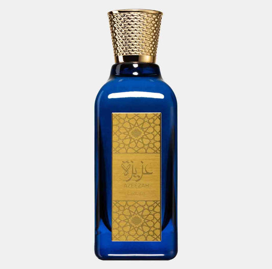 Azeezah by Lattafa Perfumes is a luxurious sample fragrance presented in an elegant blue bottle with a decorative gold label and a textured gold cap. The design reflects a blend of modern and traditional elements, showcasing the essence of the perfume.