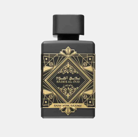 A sleek black perfume bottle adorned with intricate gold designs, featuring the label 'Lattafa Perfumes Oud for Glory Sample'.