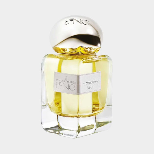 A glass bottle of Lengling No. 7 - Sekushi Sample perfume featuring a rounded gold cap and a sleek design, filled with a light yellow fragrance.