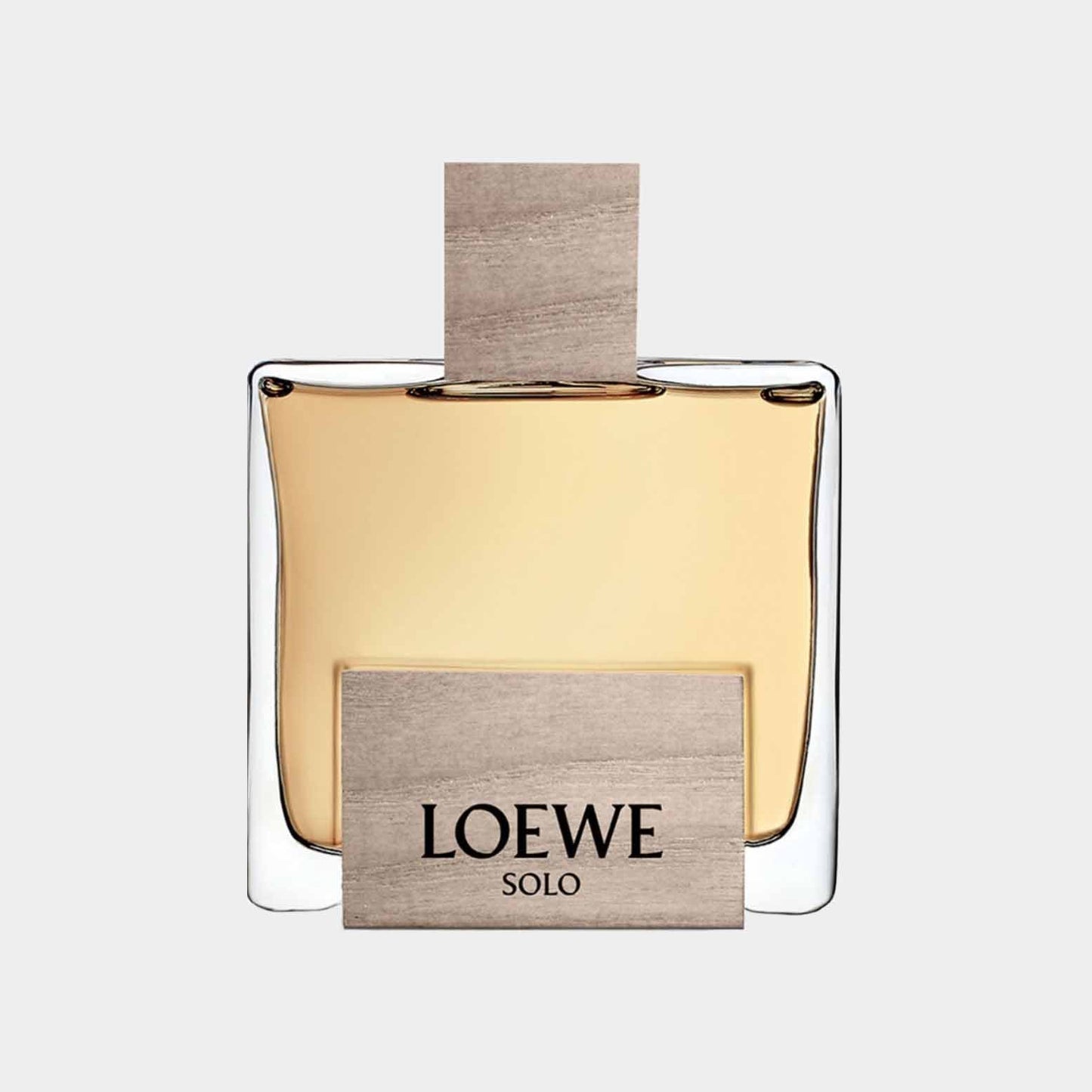 Loewe Solo Cedro Sample is an elegant glass fragrance bottle with a wooden cap and a minimalist design. The label features the brand name Loewe prominently displayed.