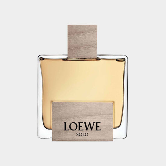 Loewe Solo Cedro Sample is an elegant glass fragrance bottle with a wooden cap and a minimalist design. The label features the brand name Loewe prominently displayed.