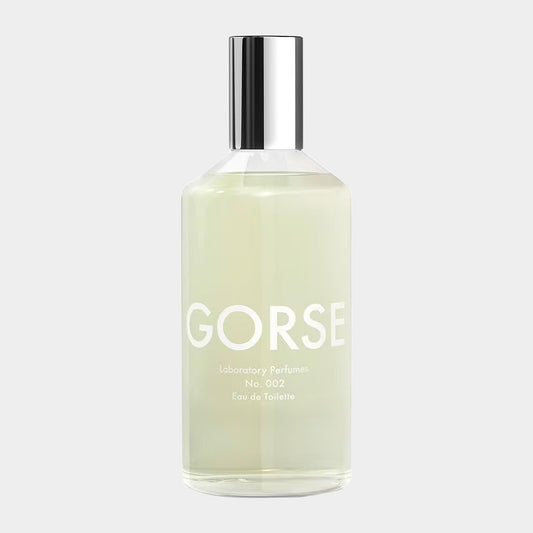 A bottle of Laboratory Perfumes Gorse Sample, an Eau de Toilette, featuring a minimalist design with a clear liquid and a reflective silver cap. The label prominently displays GORSE and No. 002.