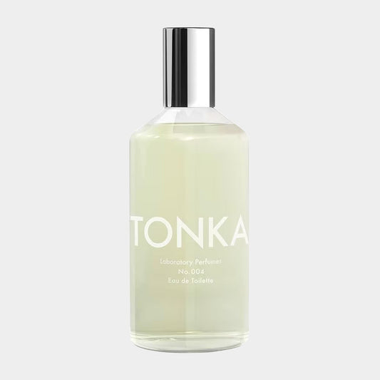 A sleek glass bottle of Laboratory Perfumes Tonka Sample, labeled TONKA in bold letters, containing a light green liquid perfume, designed as an Eau de Toilette.