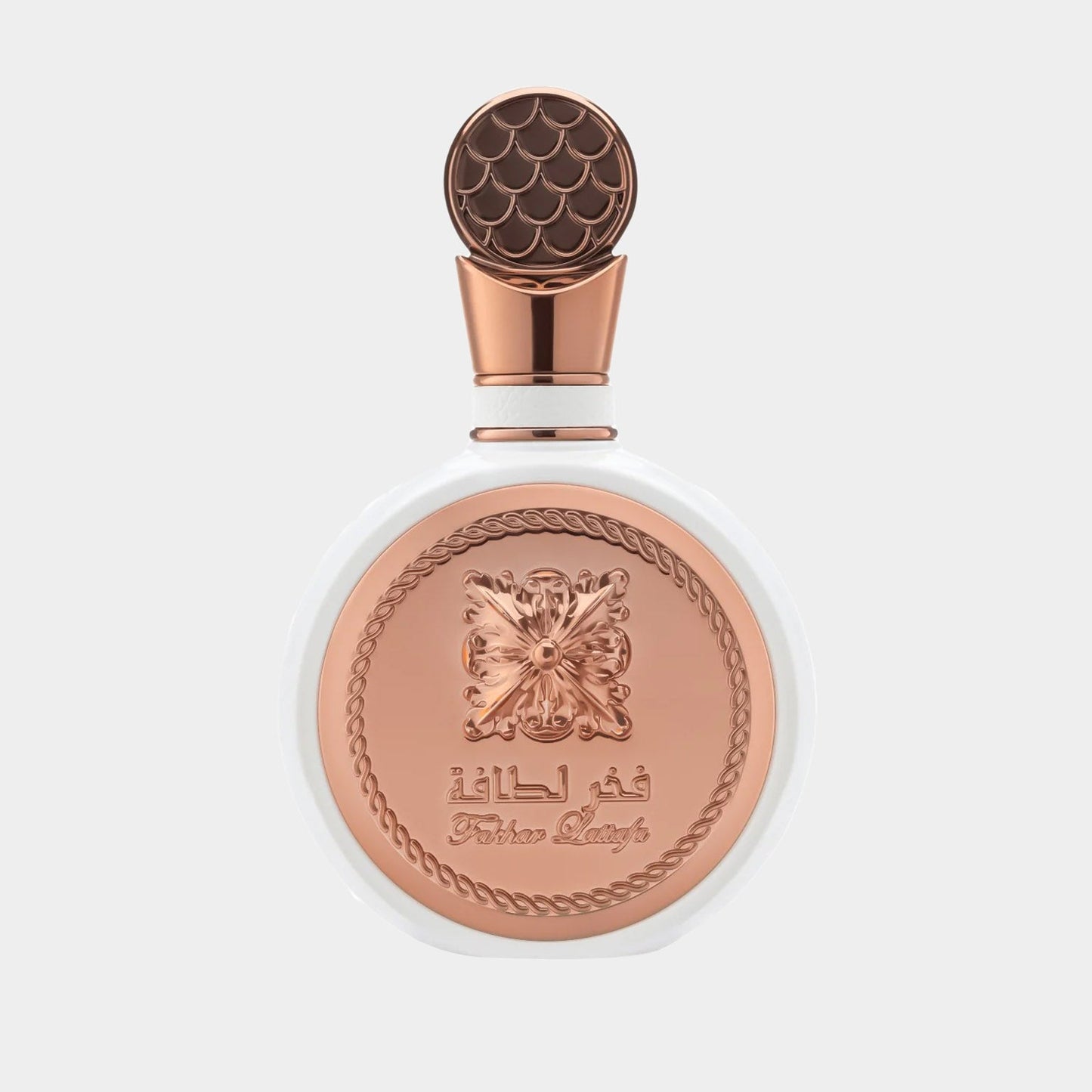 A beautifully designed bottle of Lattafa Perfumes Fakhar Rose Sample, featuring a white base and an ornate copper lid with intricate detailing. The elegant label showcases the brand name prominently.