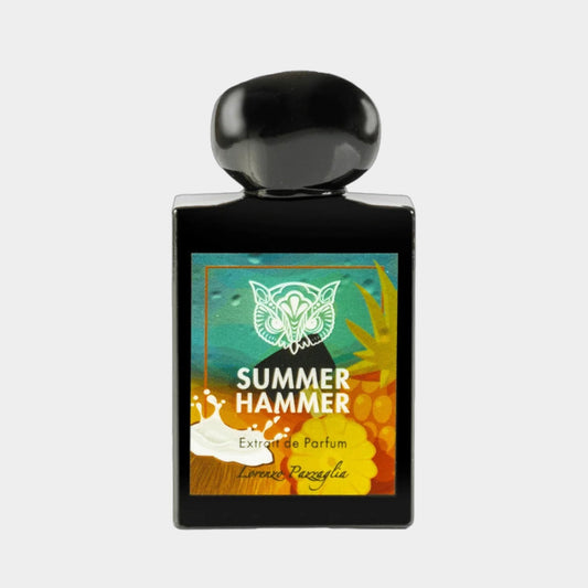 A black perfume bottle featuring a colorful label with the name Summer Hammer and the designer's name, Lorenzo Pazzaglia. The design includes vibrant tropical elements, reflecting a fresh and summery scent.
