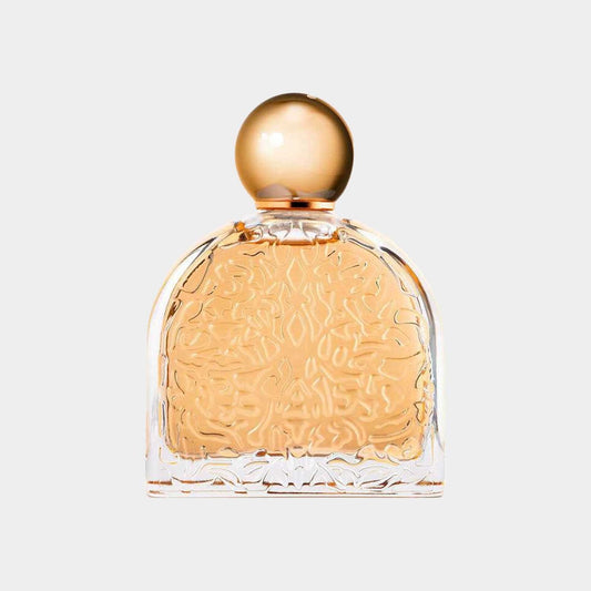 M. Micallef Ô Féminin Sample fragrance displayed in an elegantly designed glass bottle with intricate patterns and a golden cap.