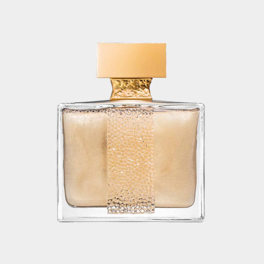 A bottle of M. Micallef Ylang in Gold Sample perfume, featuring a sleek rectangular design with a gold accent and a textured strip, showcasing its luxurious fragrance. The bottle contains a shimmering golden liquid, reflecting elegance and sophistication.