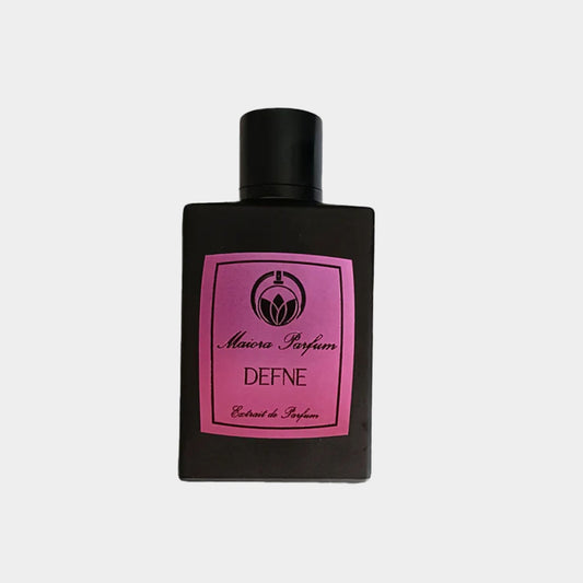 A sleek black bottle of Maiora Defne Sample, featuring a pink label with the brand name and fragrance title. This elegant perfume is designed for a sophisticated scent experience.