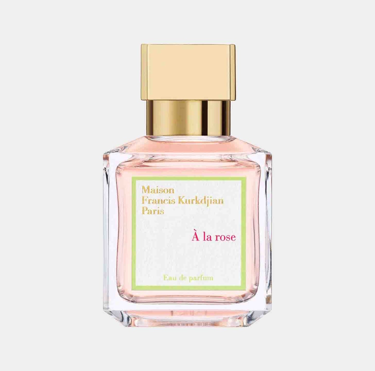 A Maison Francis Kurkdjian À La Rose sample bottle featuring a delicate pink fragrance in a clear glass container, topped with a gold cap. The label showcases the brand and perfume name in elegant lettering.