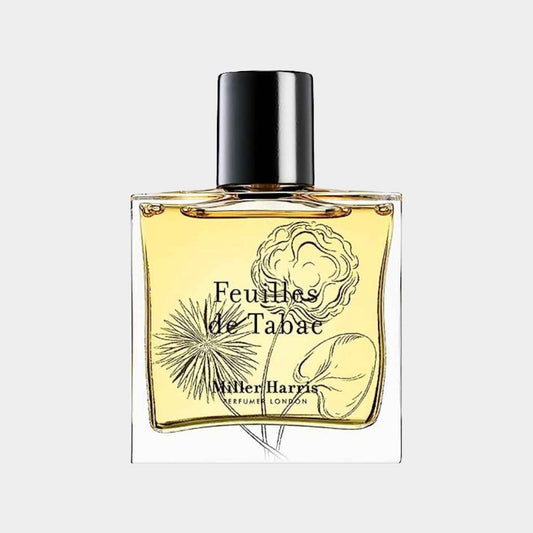 Miller Harris Feuilles de Tabac Sample is a small, elegantly designed perfume bottle featuring an intricate floral and botanical illustration. The fragrance inside has a warm, earthy scent profile.