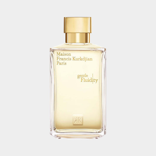 Sample bottle of Maison Francis Kurkdjian Gentle Fluidity Gold Edition, featuring a sleek design with a golden cap and subtle branding on a clear glass container. The fragrance is highlighted by a warm, inviting color.