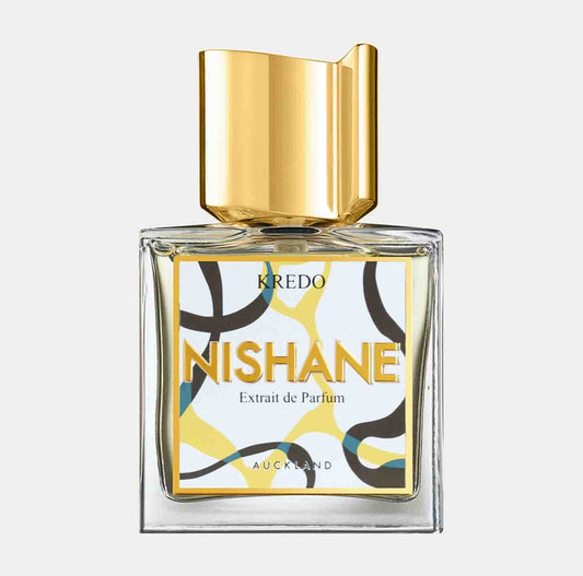 A bottle of Nishane Kredo Sample, featuring a geometric design in vibrant colors and a gold cap, showcasing the Extrait de Parfum label.