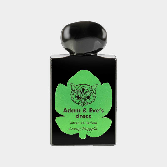 A sleek black perfume bottle labeled Adam & Eve's Dress with a vibrant green leaf design, featuring the name Lorenzo Pazzaglia.