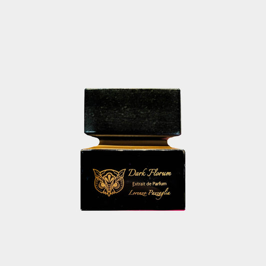 A small black bottle of Lorenzo Pazzaglia Dark Florum Extrait de Parfum, featuring elegant gold lettering on the front. The design is sleek and sophisticated, highlighting the luxurious essence of the fragrance inside.
