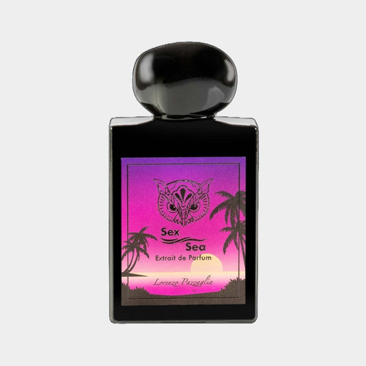 A full bottle of Lorenzo Pazzaglia Sex Sea, featuring an artistic label with a gradient of pink and purple skies, silhouettes of palm trees, and a decorative butterfly emblem. The bottle has a sleek black design with a rounded cap.