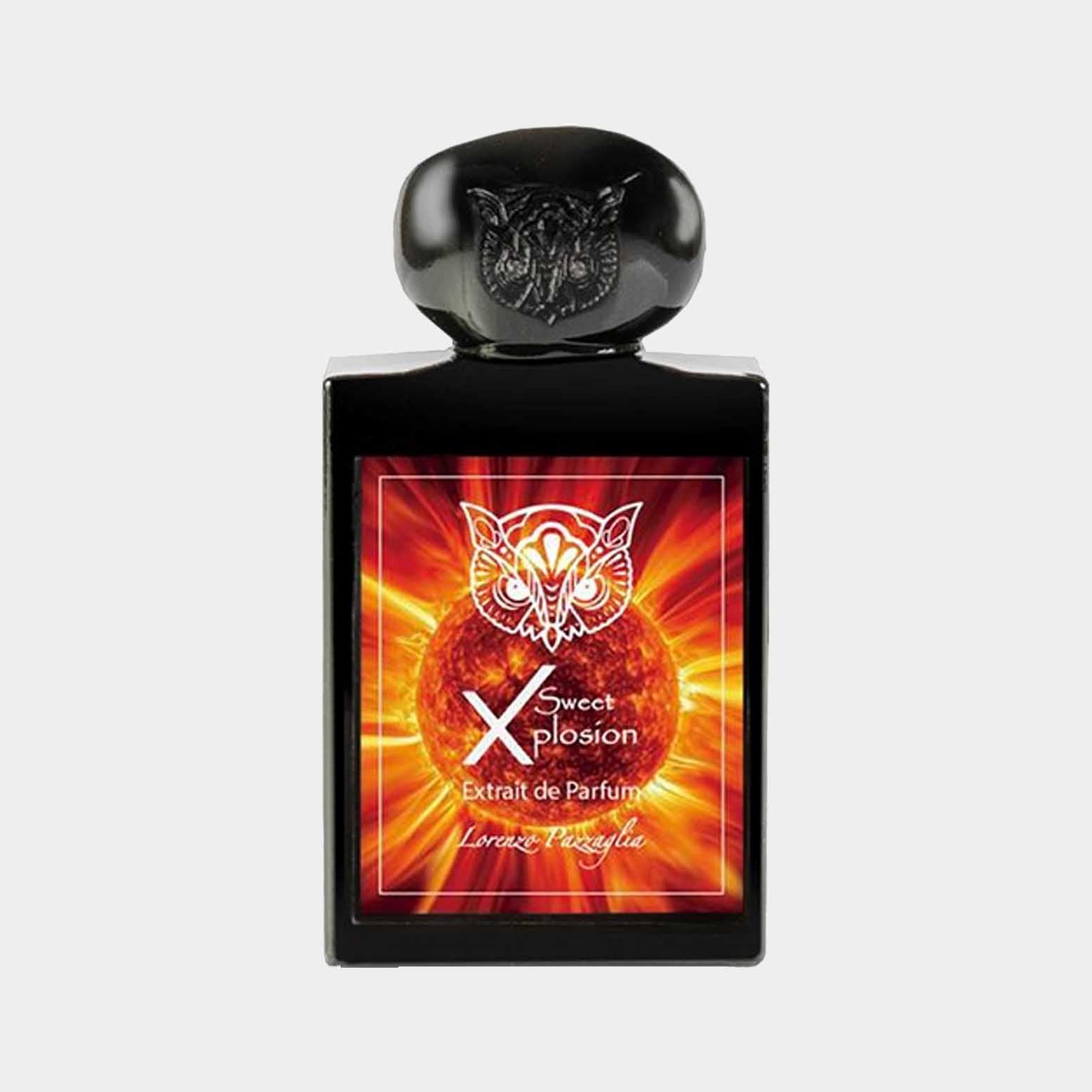 A full bottle of Lorenzo Pazzaglia Sweet Xplosion, featuring a striking black flacon adorned with a logo, set against a vibrant, fiery background. The perfume is labeled as Extrait de Parfum, indicating its rich concentration.