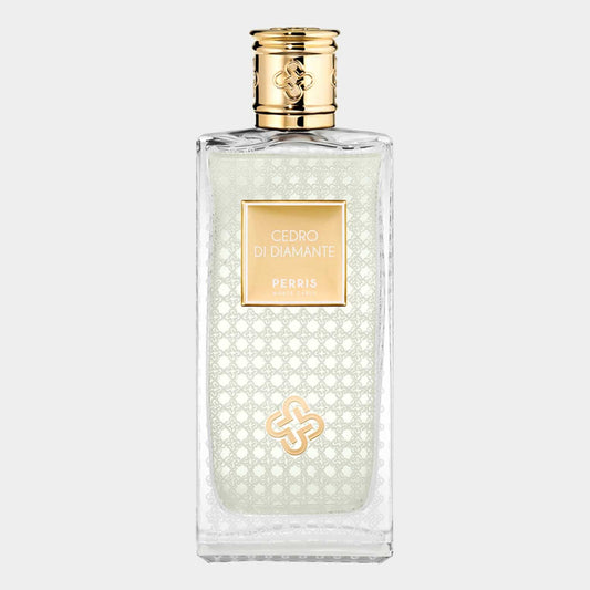 Perris Monte Carlo Cedro di Diamante Sample is an elegant fragrance bottle featuring a translucent design with intricate patterns and a gold-accented label. The light green liquid inside signifies a refreshing and luxurious scent.