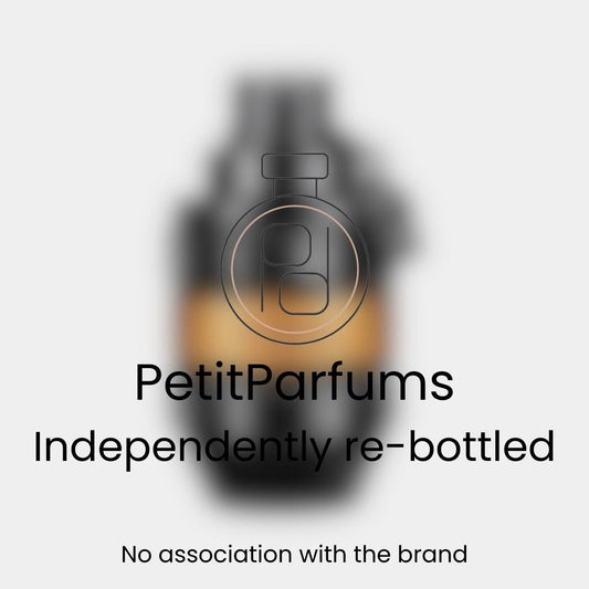 Spicebomb Extreme Sample bottle featuring a distinctive grenade shape, displayed with a blurred background. The label indicates it is independently re-bottled by PetitParfums.