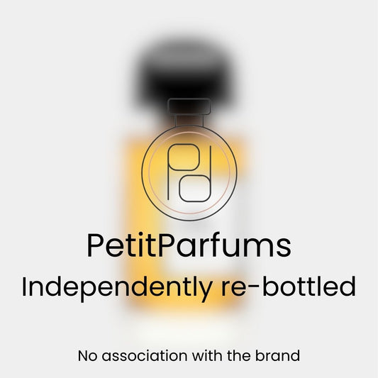 Nuit de Sable Sample by PetitParfums, featured in a re-bottled glass vial with a black cap, showcasing a warm amber hue.