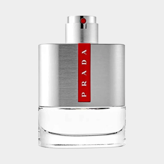 A sleek, silver and clear bottle of Prada Luna Rossa Sample, featuring a prominent red logo and a minimalist design, perfect for a modern fragrance.