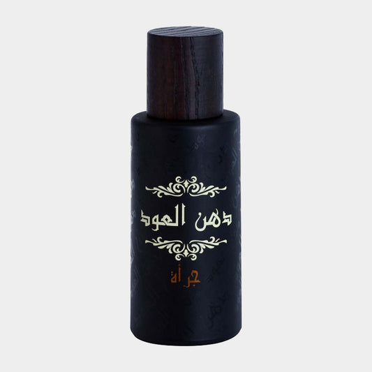 Rasasi Dhan Al Oudh Jurrah Sample is a sleek, dark bottle with an ornate design and a wooden cap, showcasing the luxurious fragrance within.