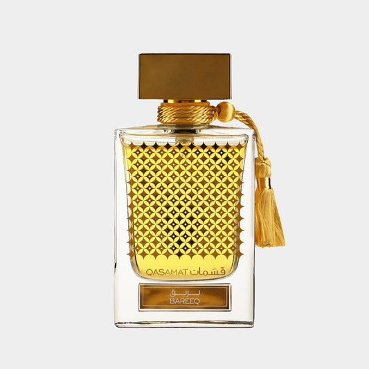 Rasasi Qasamat Bareeq Sample is an elegant perfume bottle with a textured golden design and a tassel, showcasing a luxurious fragrance experience.