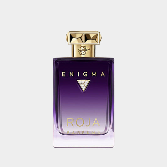 Roja Dove Enigma Pour Femme Essence De Parfum Sample features an elegant glass bottle with a gradient purple hue, adorned with a gold cap and diamond detailing. This luxurious fragrance captures a sense of mystery and sophistication.