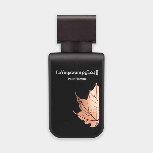 A sleek black sample bottle of Rasasi La Yuqawam Homme perfume, featuring an elegant rose gold leaf design and the name 'La Yuqawam Pour Homme' prominently displayed.
